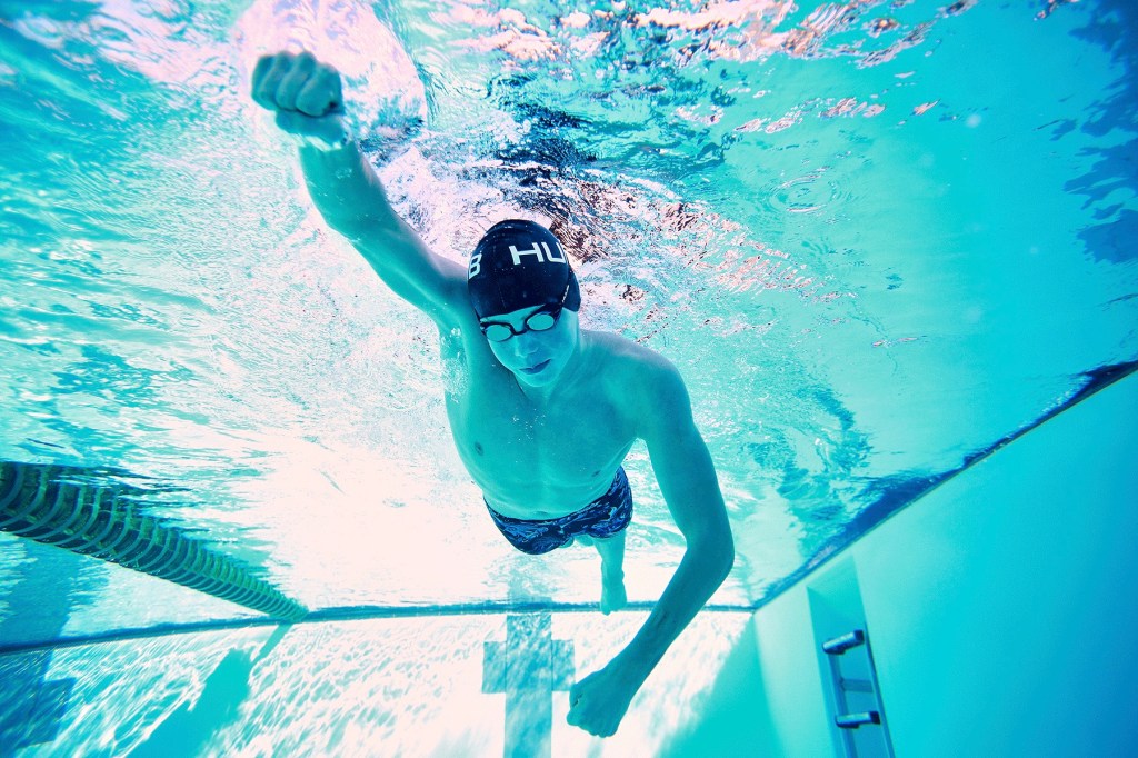 Swimmer demonstrating a fist swimming drill