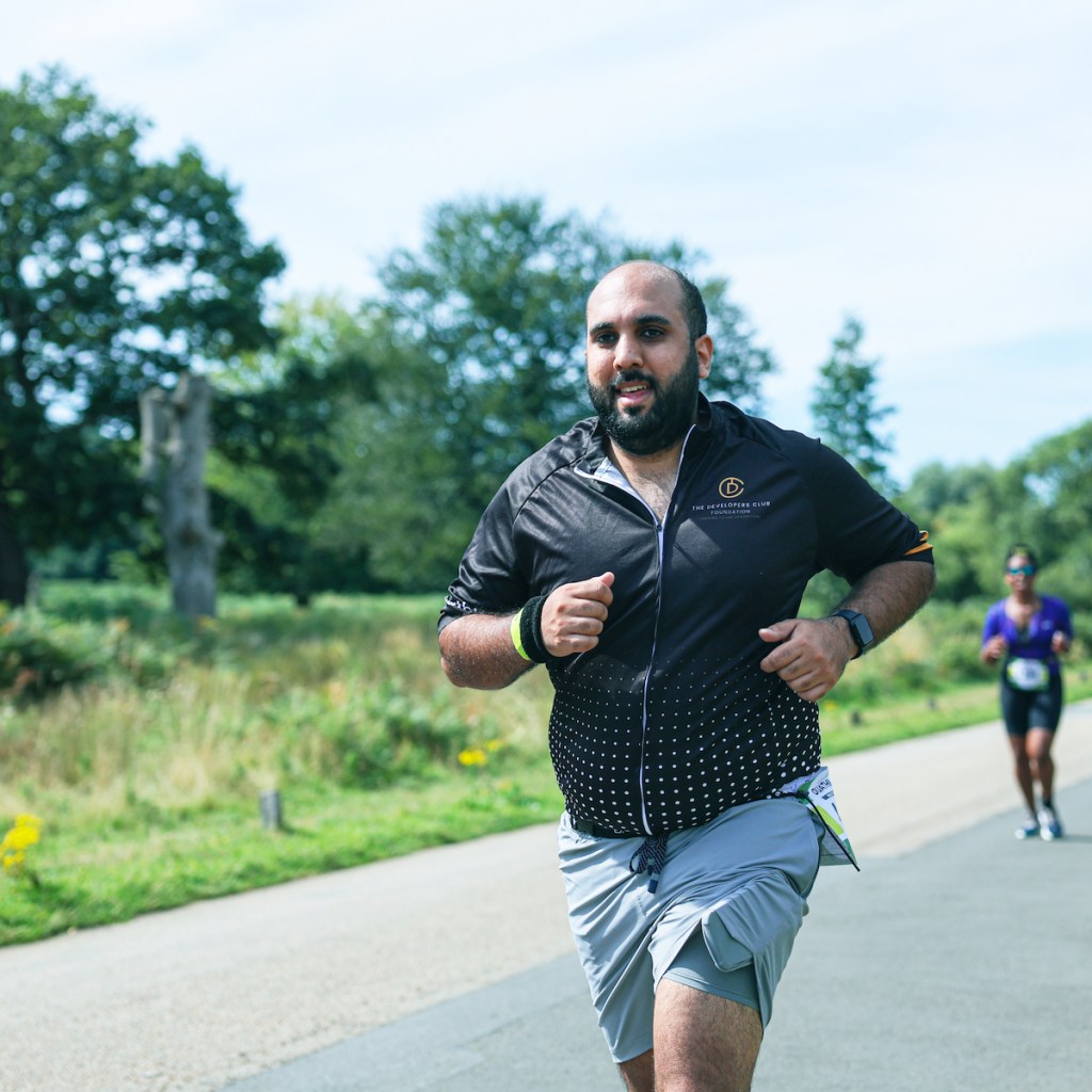 Man racing London Duathlon wearing shorts and a tee