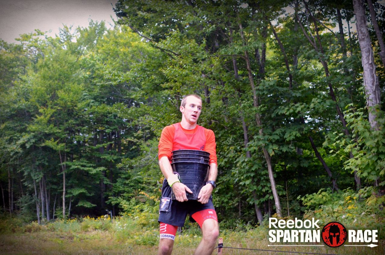 Jonathan Albon carrying a bucket at the Spartan World Championship