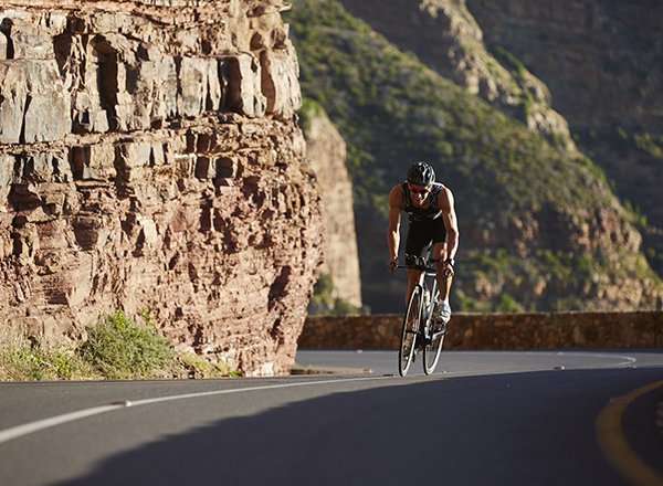 What should your body position be when cycling uphill?