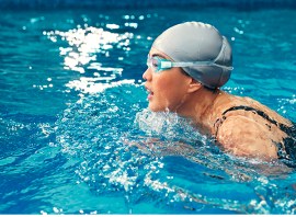 Which muscles does breaststroke use and tone?