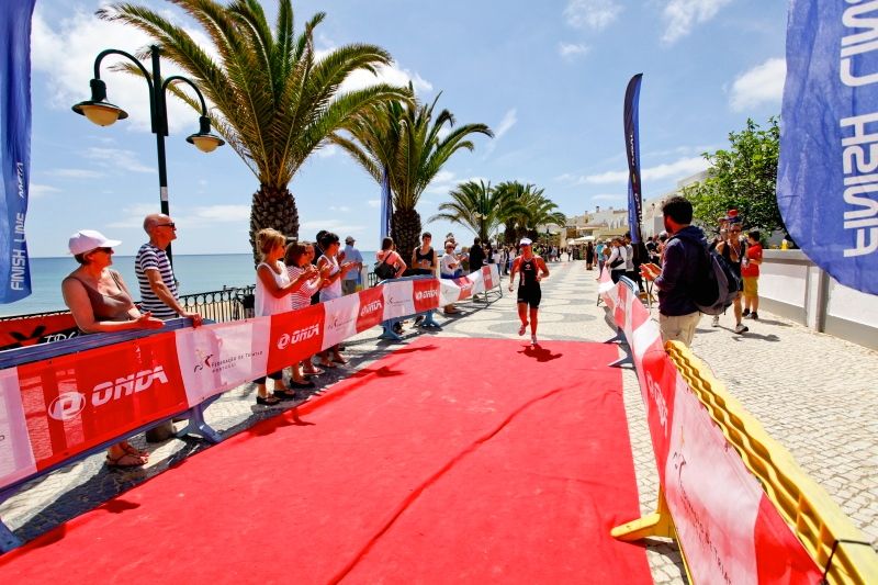 Triathlete finishing the run at Martinhal Triathlon in Algarve, Portugal