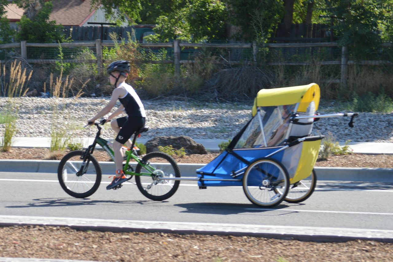 Noah and Lucas Aldrich cycling in the triathlon