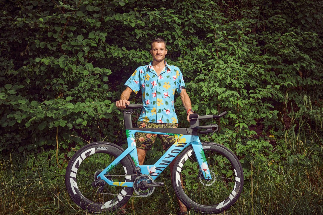 Jan Frodeno stands with the new limited edition Canyon Speedmax