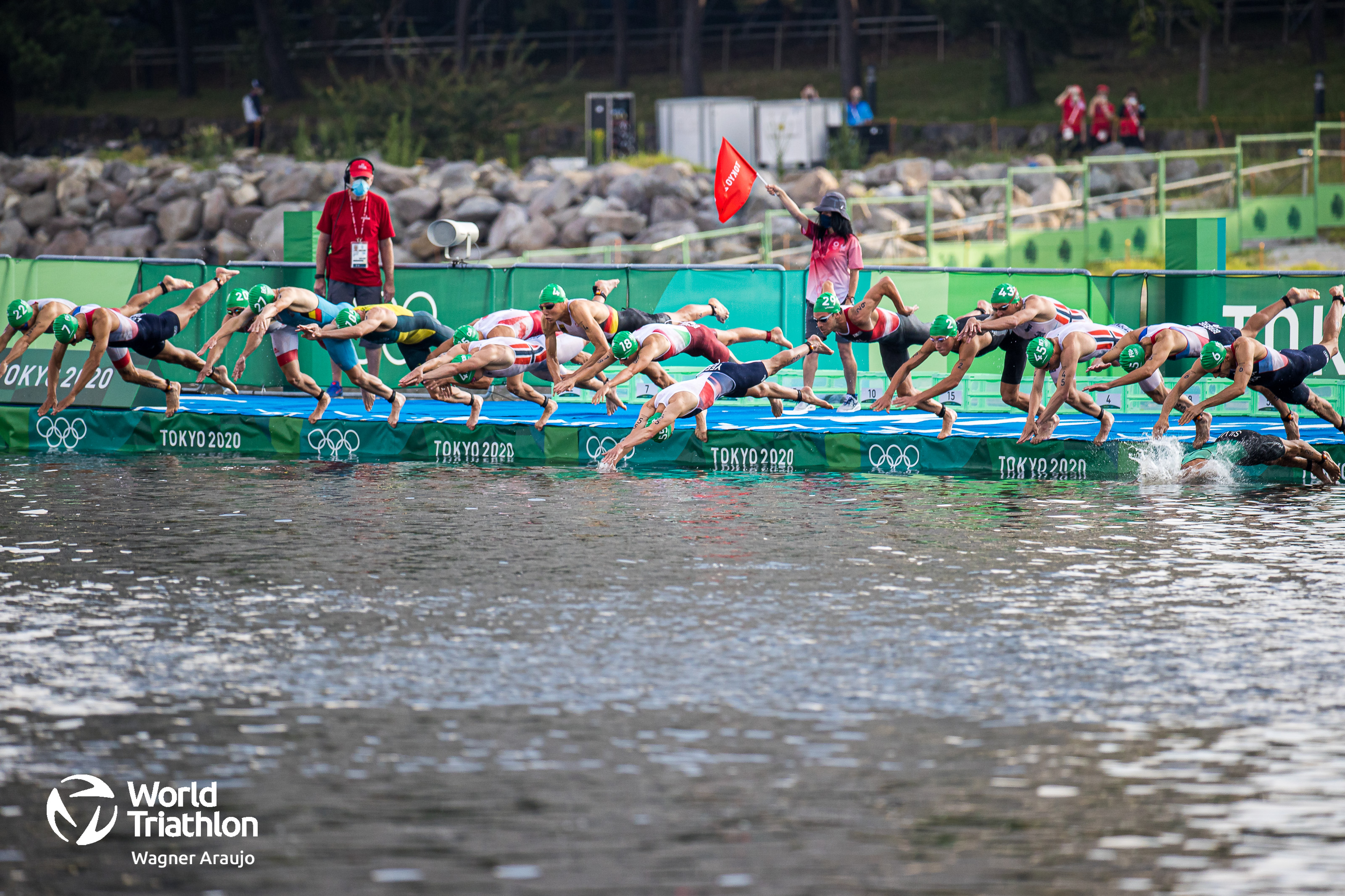 After a false start where a RIB was partially obstructing the pontoon, the men dive into the water for their first 950m lap. 