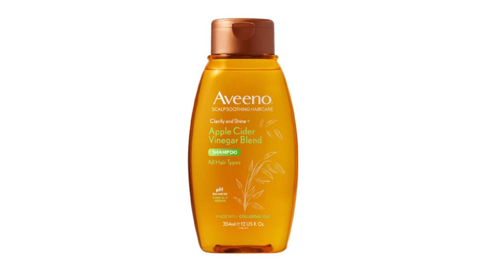 Aveeno Clarify & Shine Apple Cider Vinegar Shampoo on white background