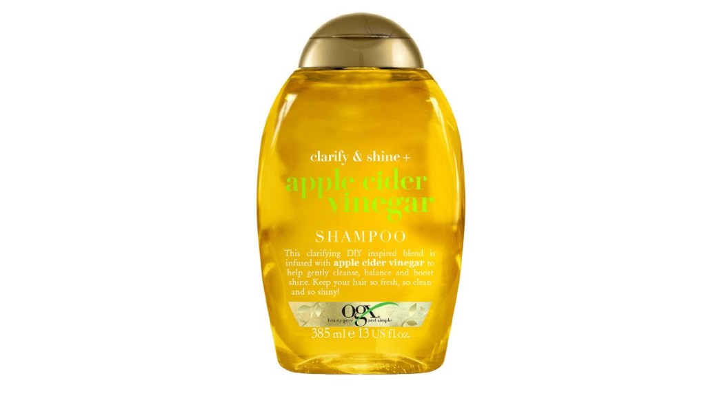 OGX Apple Cider Vinegar Shampoo on white background