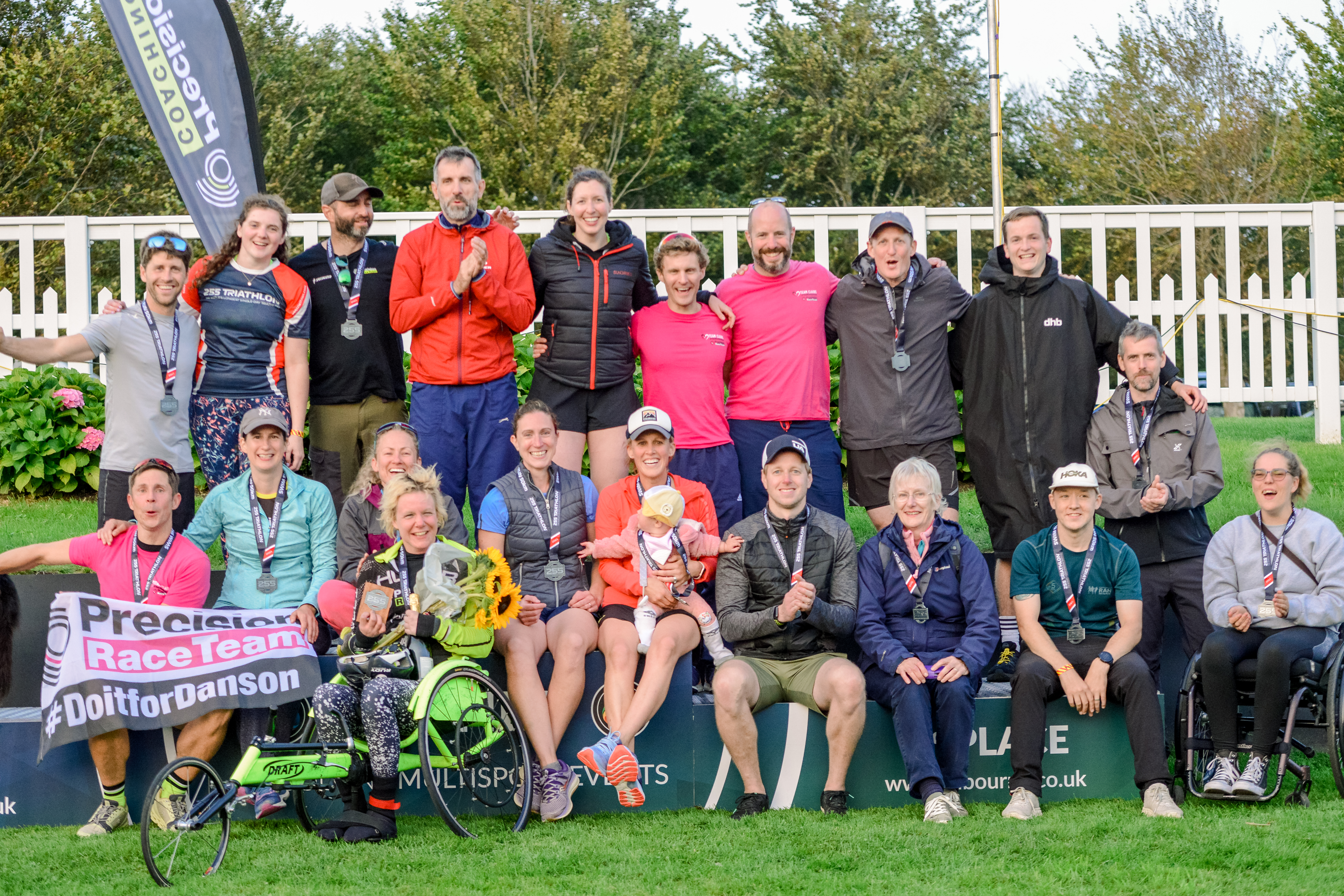 Claire's team of supporters, family and friends crowd the podium / My Sports Photos