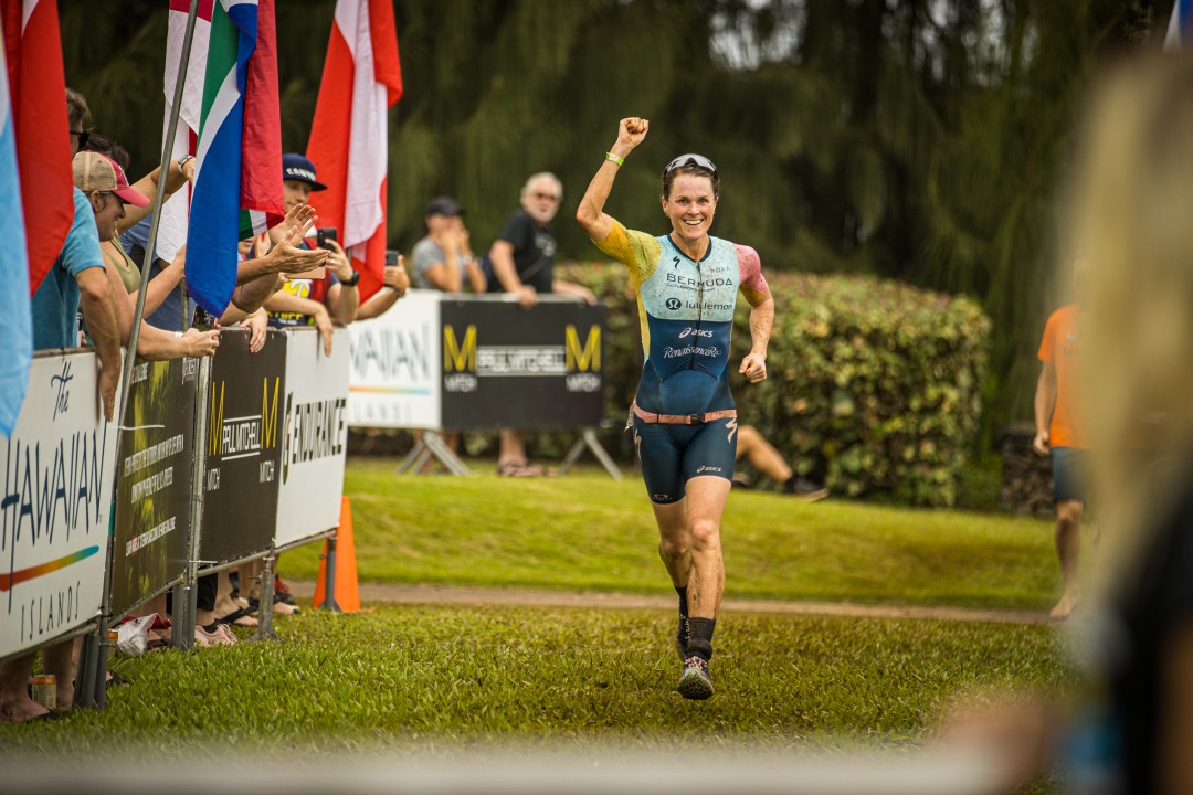 Flora Duffy celebrates with the crowd as she heads in to take her sixth Xterra world title