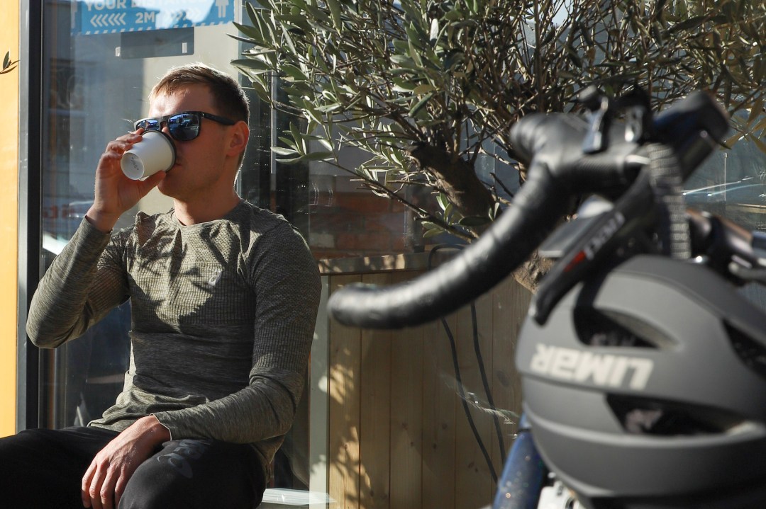 Triathlete Tom Bishop drinking coffee