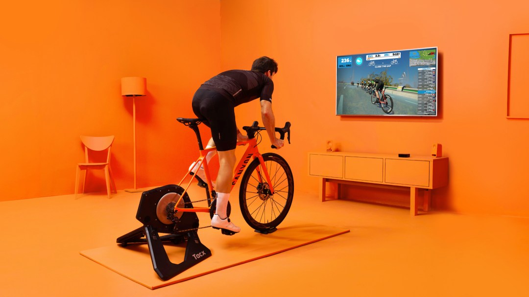Cycling in an orange room on Zwift