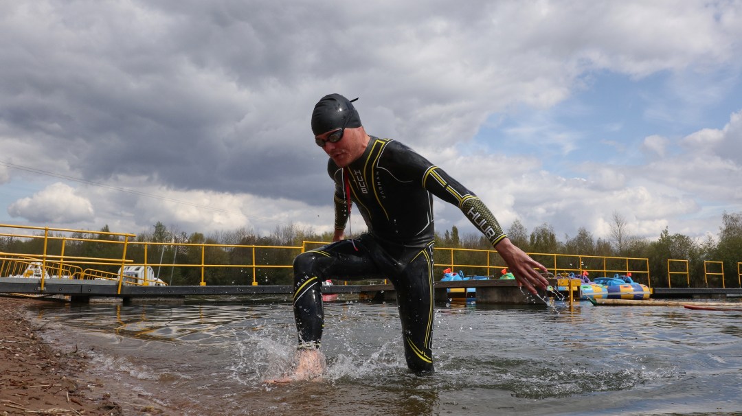 Team GB Triathlete Thomas Bishop exiting water after swim