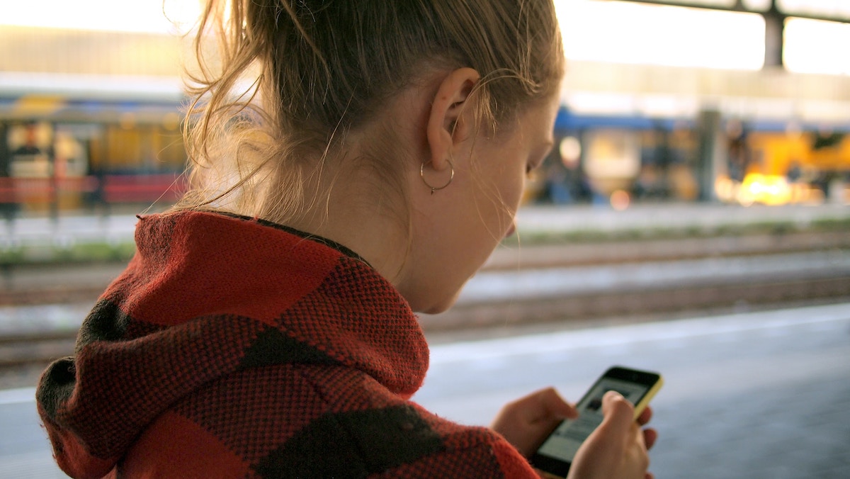 Woman looking at phone screen