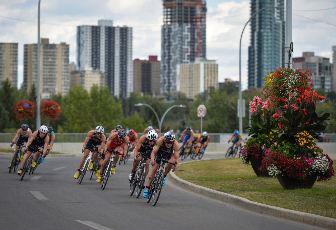 men race on bike leg of world triathlon edmonton race