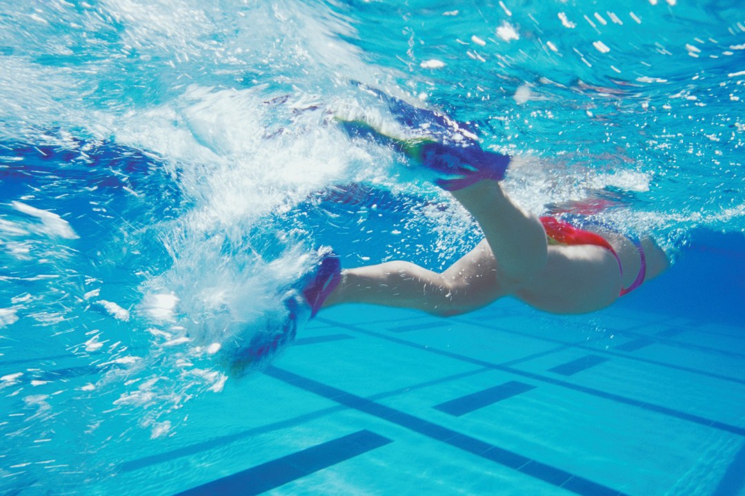Woman swimming with swim fins
