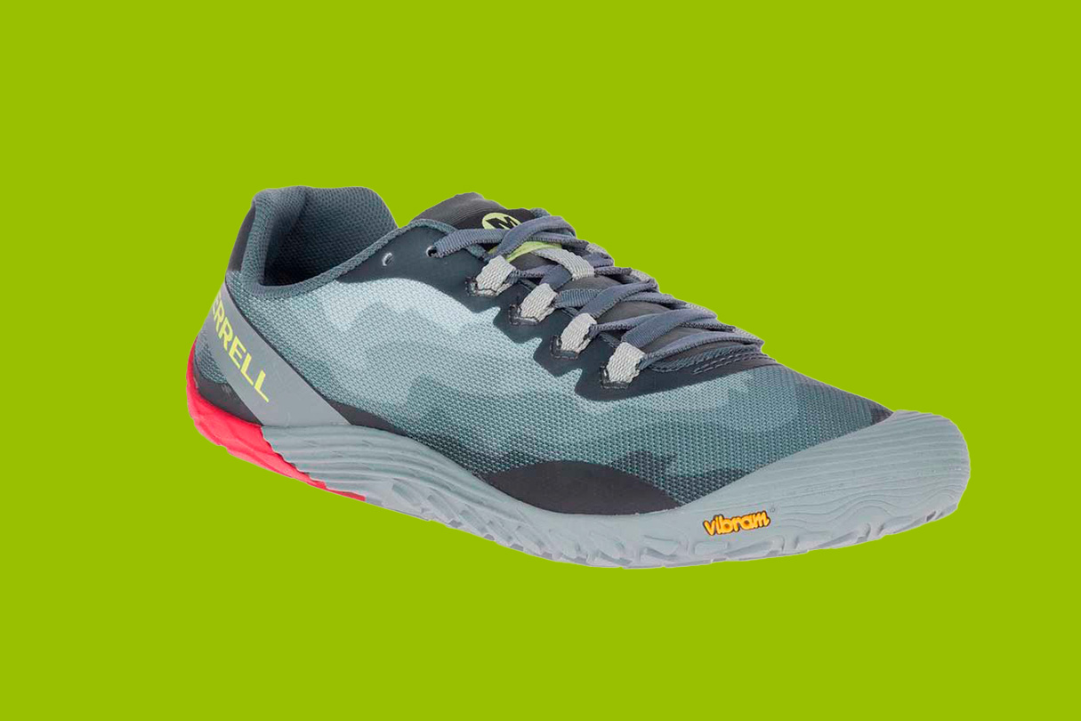 Merrell Vapor Glove 4 run shoes on a green background