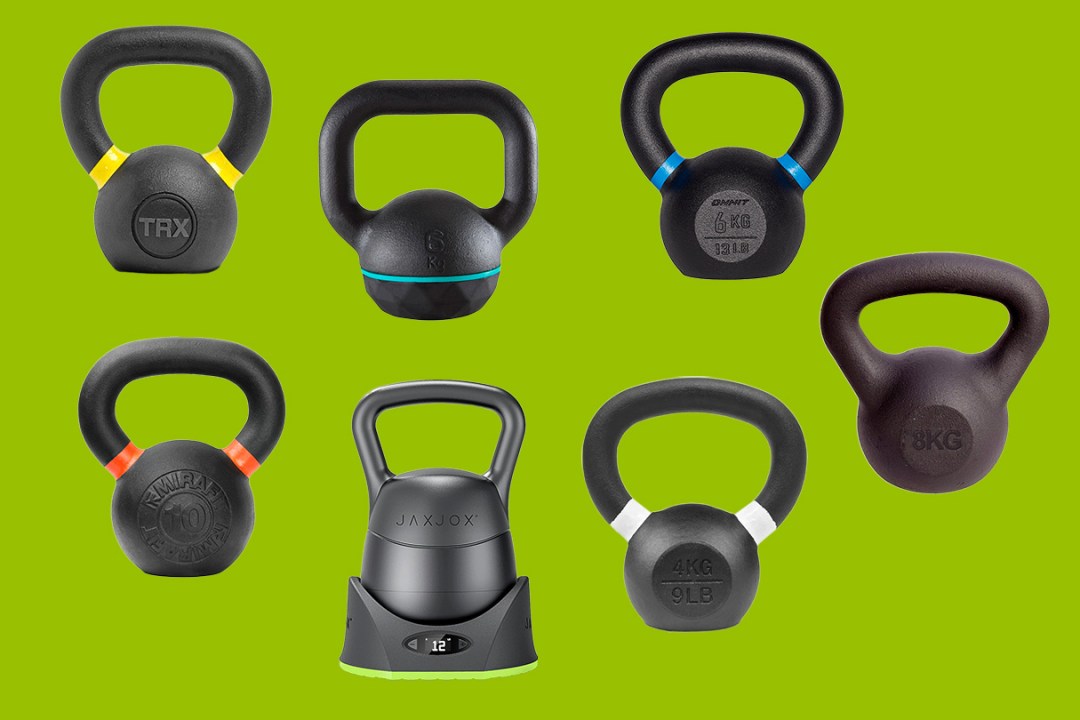 A selection of kettlebells on a green background