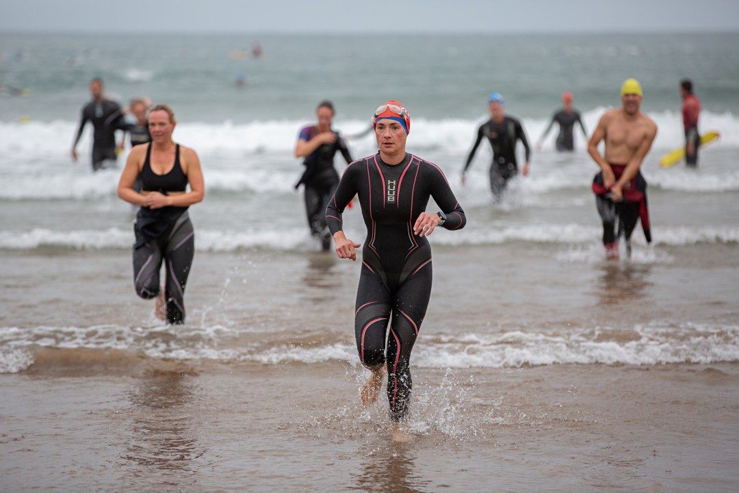 croyde traithlon swimmers coming out of water