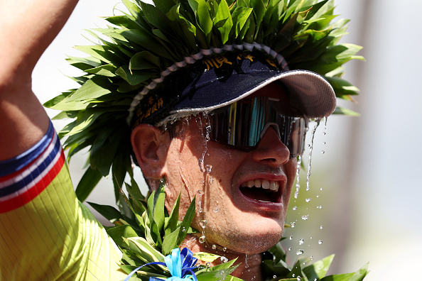 Gustav Iden of Norway pours water on his head after winning the IRONMAN World Championship