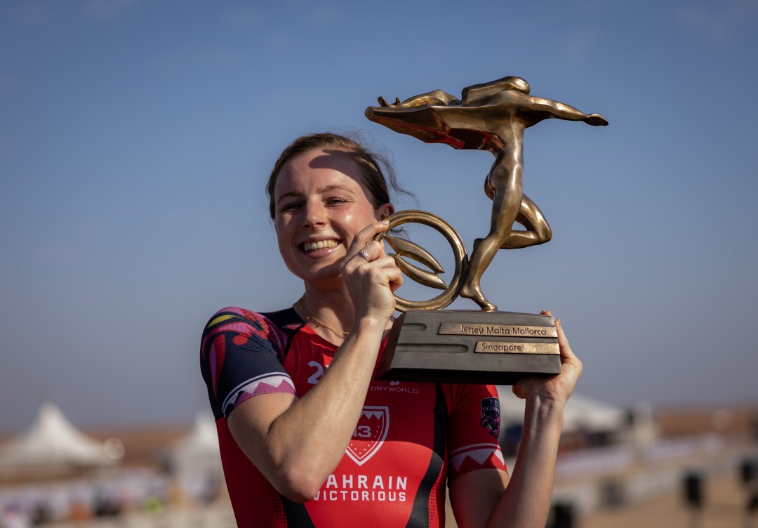 Georgia Taylor-Brown lifts the Super League Triathlon trophy after victory in Neom. Pic: Darren Wheeler - That Cameraman/Super League