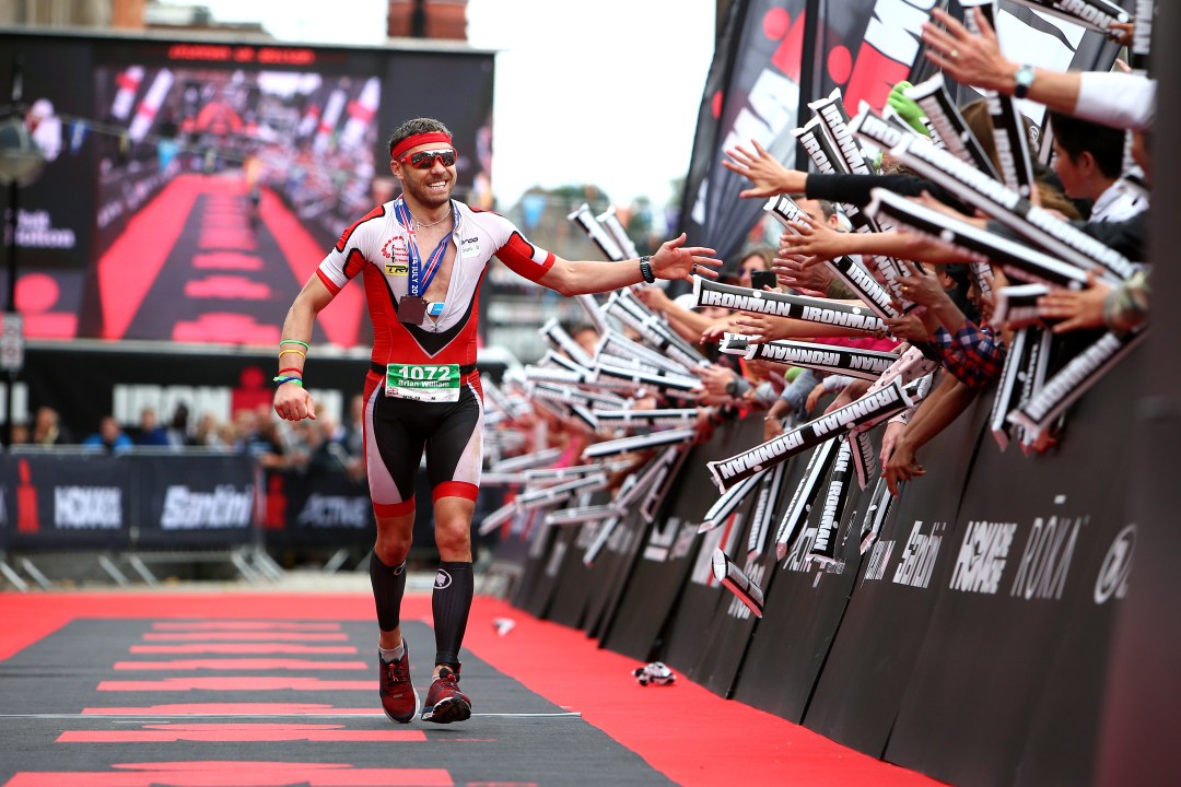 Brian Fogarty of Great Britain celebrates winning the mens race during Ironman UK on July 14, 2019 in Bolton, England.