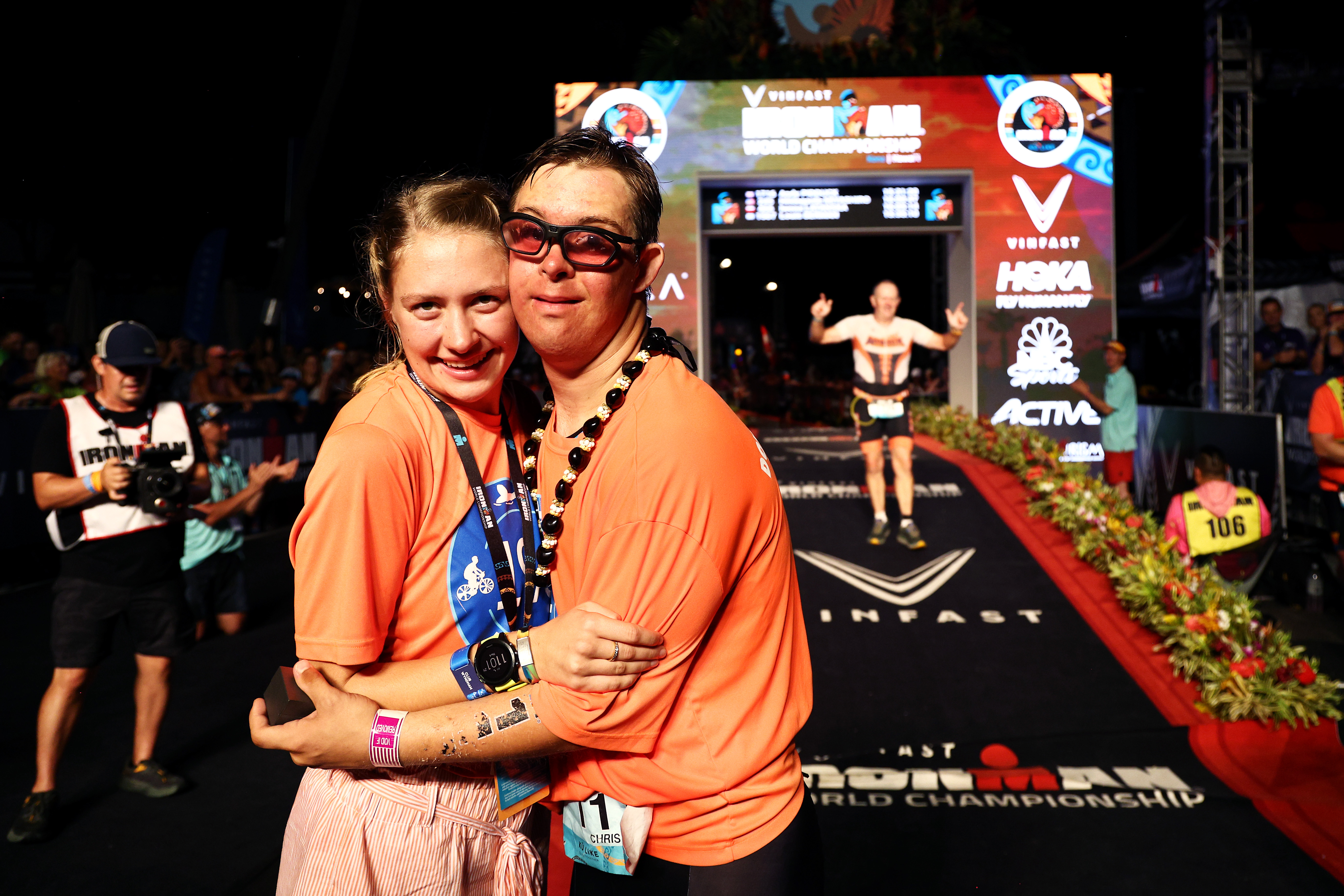 Chris Nikic the first triathlete with Downs Syndrome to complete an Ironman celebrates with his girlfriend