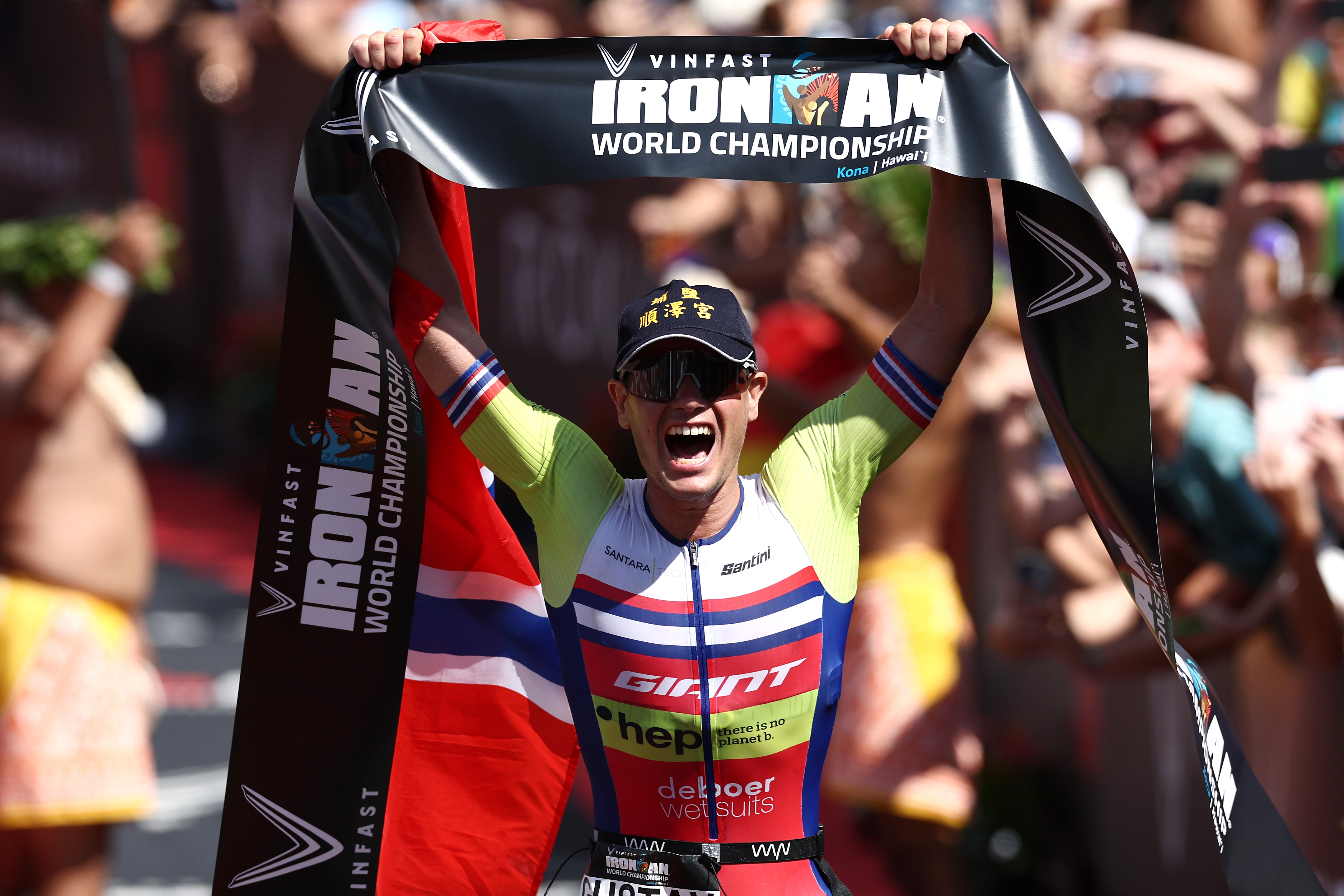 KAILUA KONA, HAWAII - OCTOBER 08: Gustav Iden of Norway celebrates after winning the IRONMAN World Championships on October 08, 2022 in Kailua Kona, Hawaii. (Photo by Tom Pennington/Getty Images for IRONMAN)