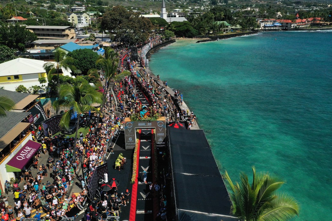 An aerial view as age groupers cross the finish line of the IRONMAN World Championships on October 08, 2022 in Kailua Kona, Hawaii.