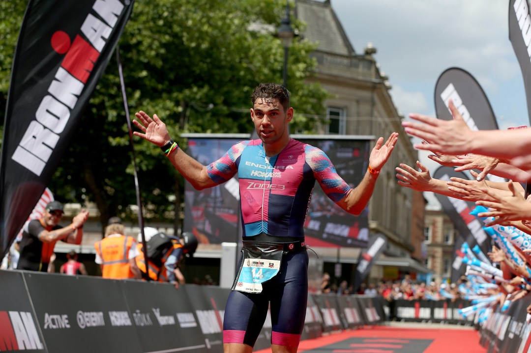 Joe Skipper of Britain celebrates winning Ironman UK on July 15, 2018 in Bolton, England