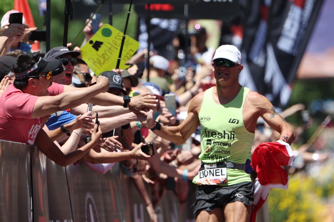 Lionel Sanders of Canada reacts as he approaches the finish line to place second during the 2021 IRONMAN World Championships on May 07, 2022 in St George, Utah.