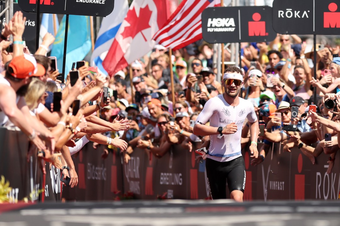 Sam Laidlow of France runs to the finish line to finish second during the IRONMAN World Championships on October 08, 2022 in Kailua Kona, Hawaii.