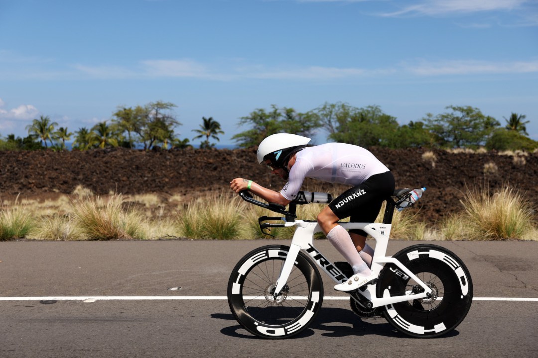 Side-on view of French triathlete Sam Laidlow on his bike racing at the 2022 Ironman World Championship