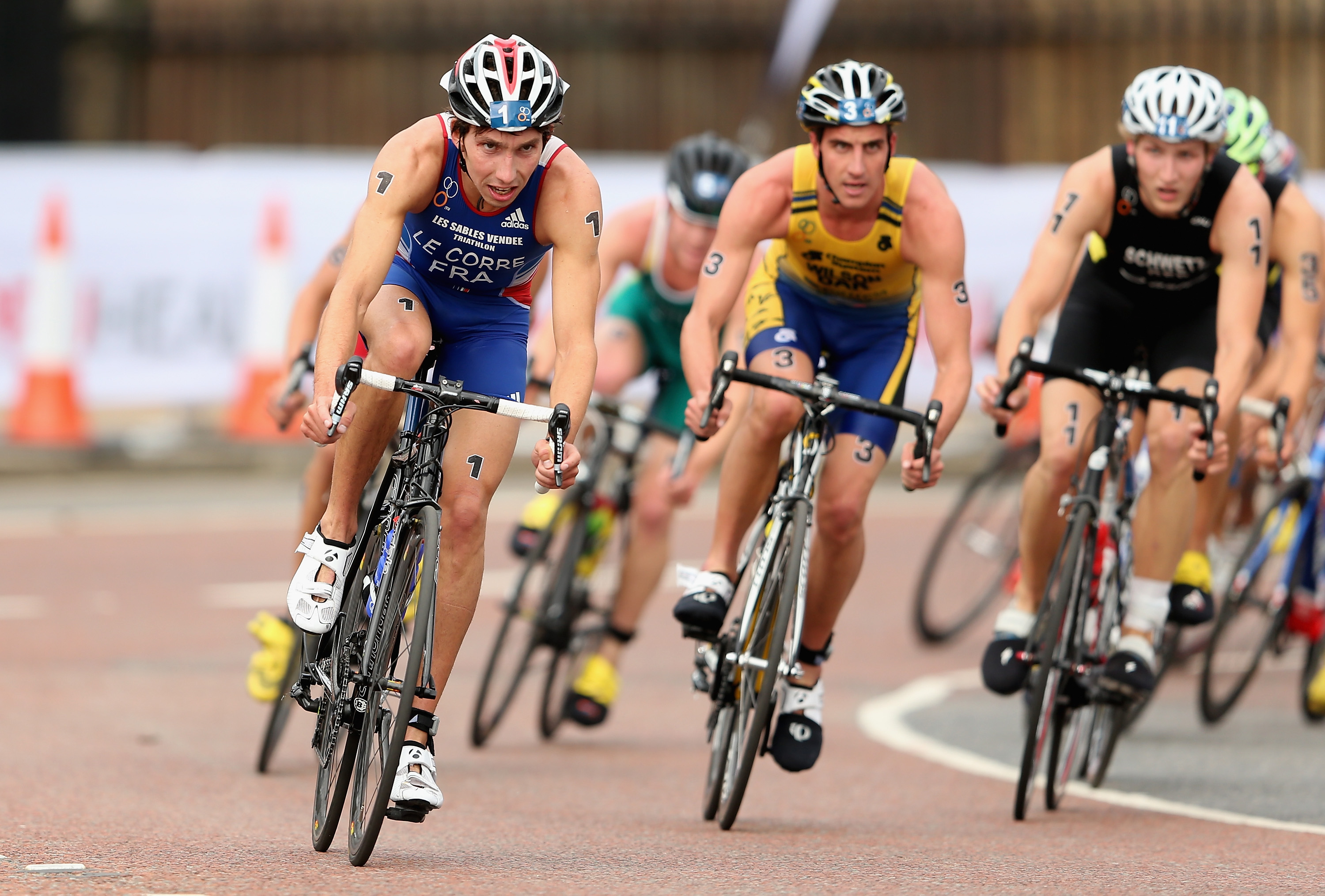 LONDON, ENGLAND - SEPTEMBER 12: Pierre Le Corre of Frances en route to winning the U-23 World Championship during the PruHealth ITU World Triathlon Grand Final London at Hyde Park on September 12, 2013 in London, England. (Photo by Warren Little/Getty Images)