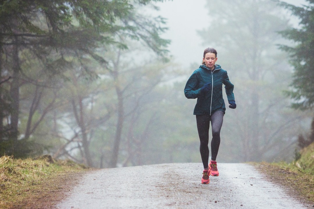 Woman running in the rain