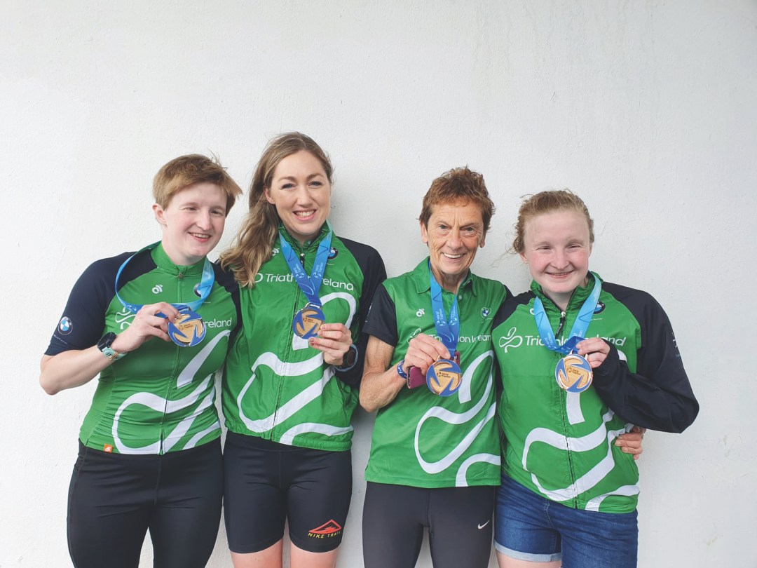 Chloe Maccombe, guide Catherine Sands, guide Anne Paul and Judith Maccombe pose with their medals after the A Coruna Para World Cup in 2022