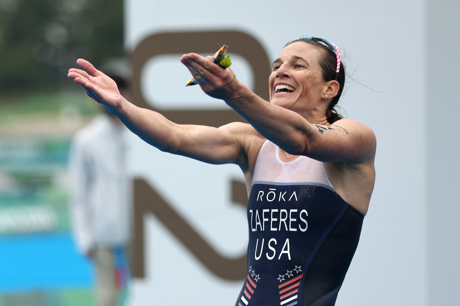 Katie Zaferes celebrates her Olympic bronze medal