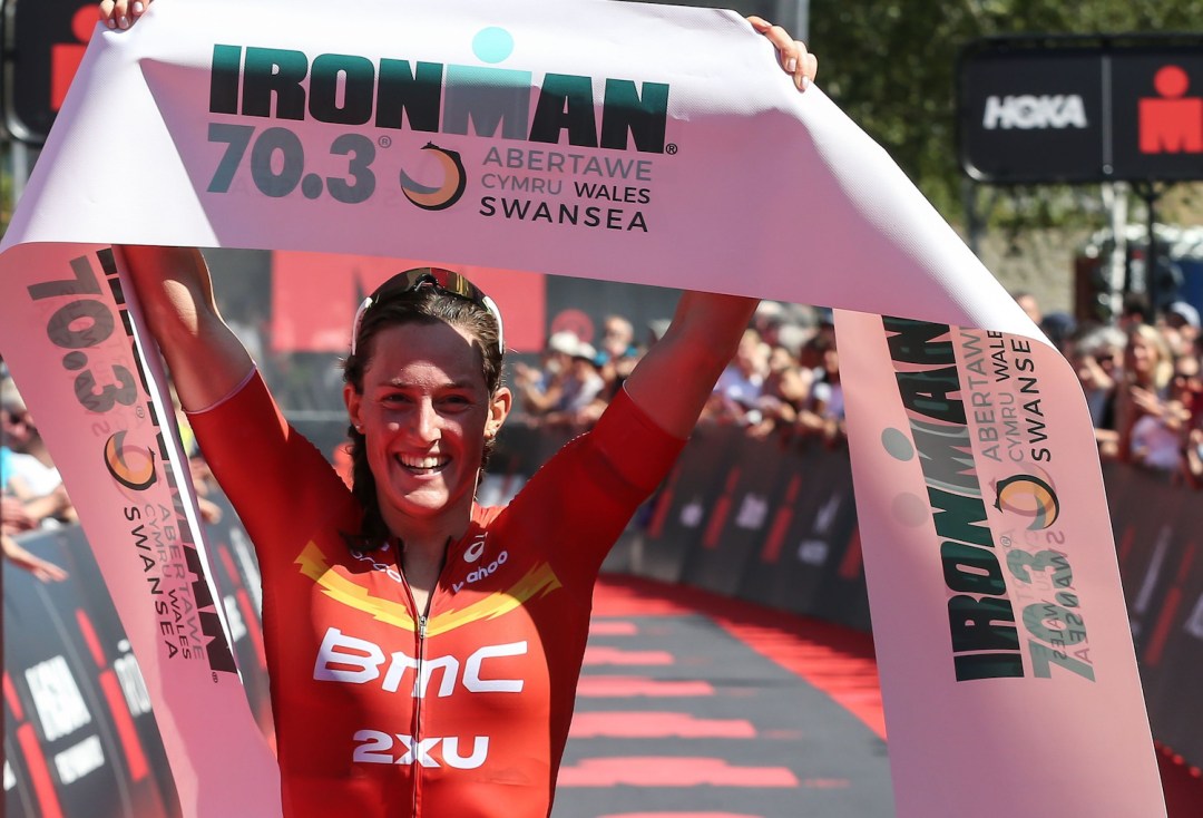 Kat Matthews celebrates at the end of Ironman 70.3 Swansea