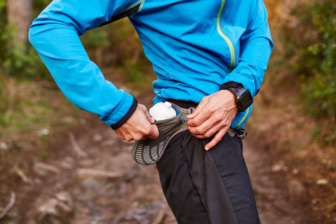 Male runner using run bum bag