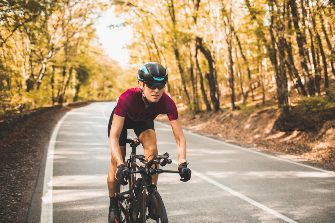 Woman cycling on a triathlon bike on an incline