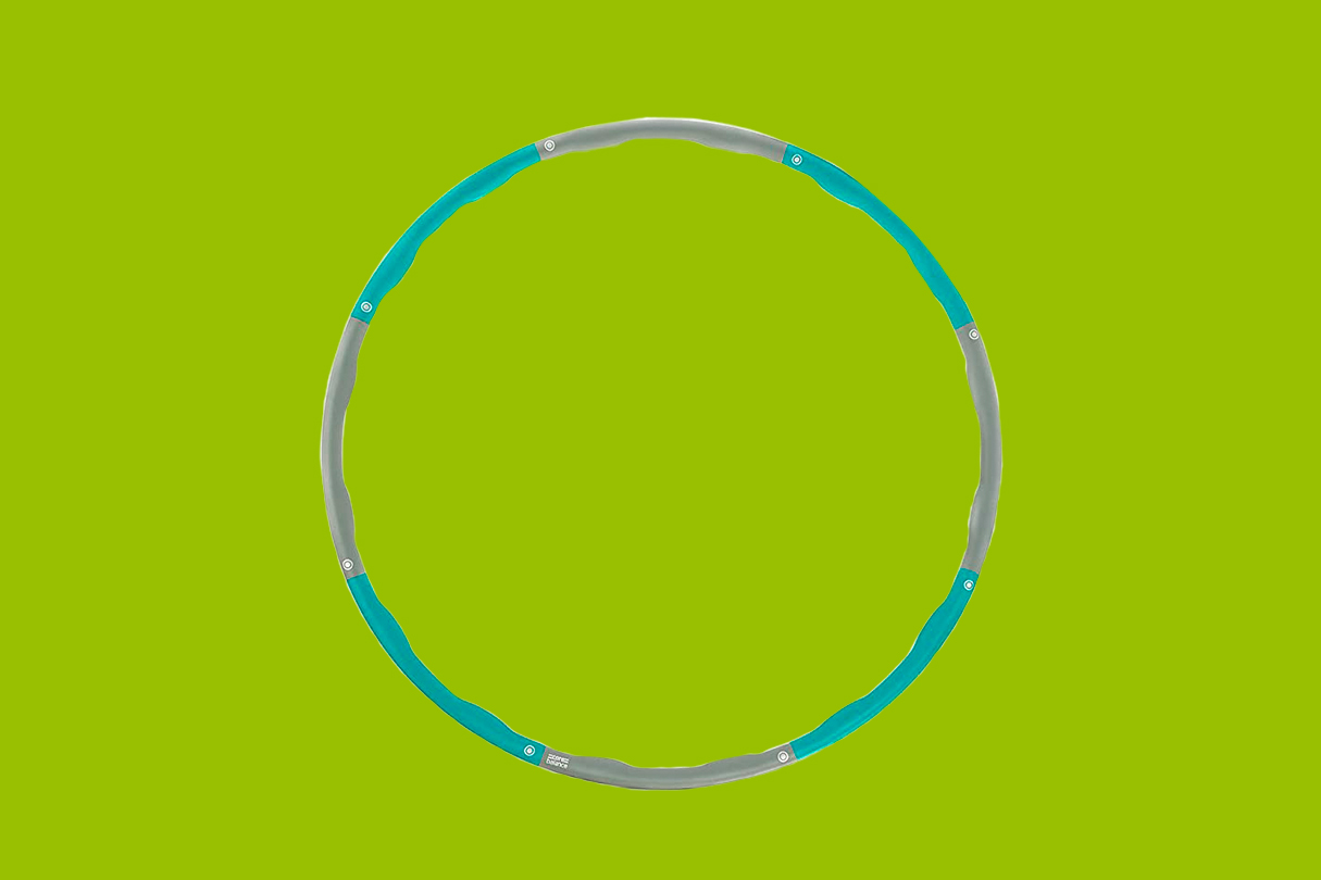 Core Balance Weighted Hula Hoop on a green background