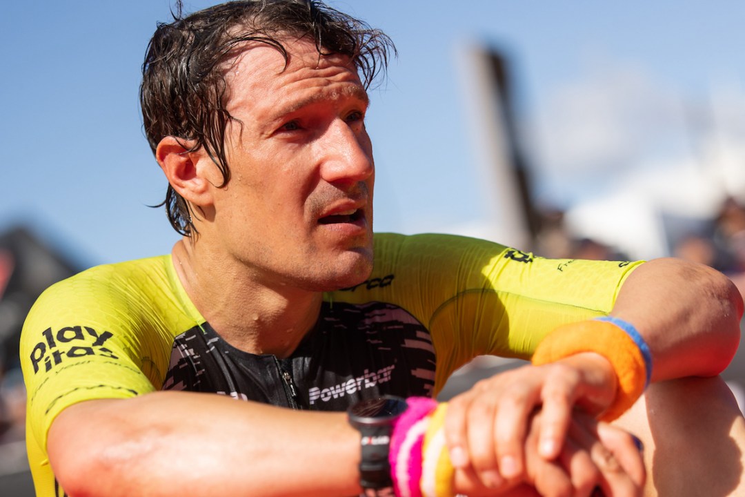 A close-up of Sebastian Kienle's face as he looks reflective having completed his first, and last, Ironman New Zealand in 2023