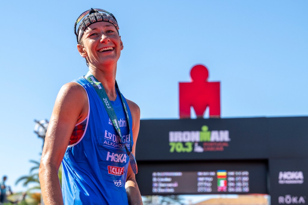 Nikki Bartlett celebrates finishing second at Ironman 70.3 Portugal Cascais on 15 October, 2022