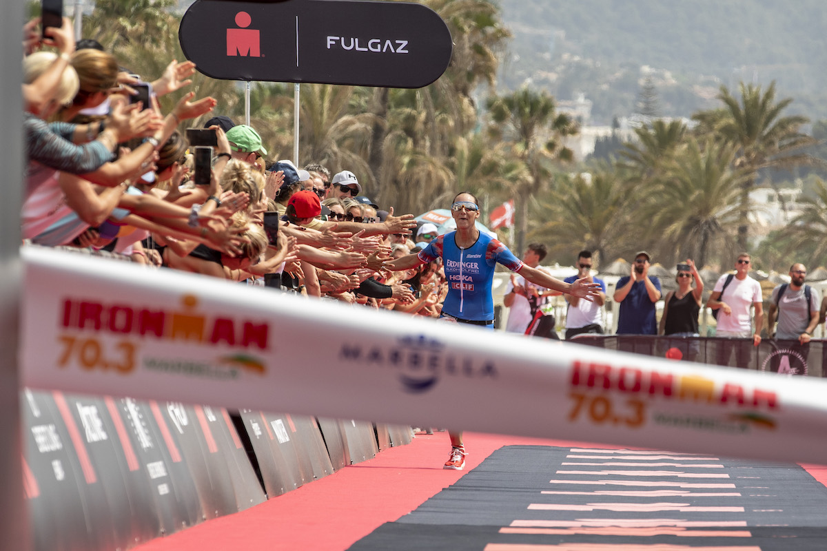 Nikki Bartlett celebrates winning Ironman 70.3 Marbella, in May 2022