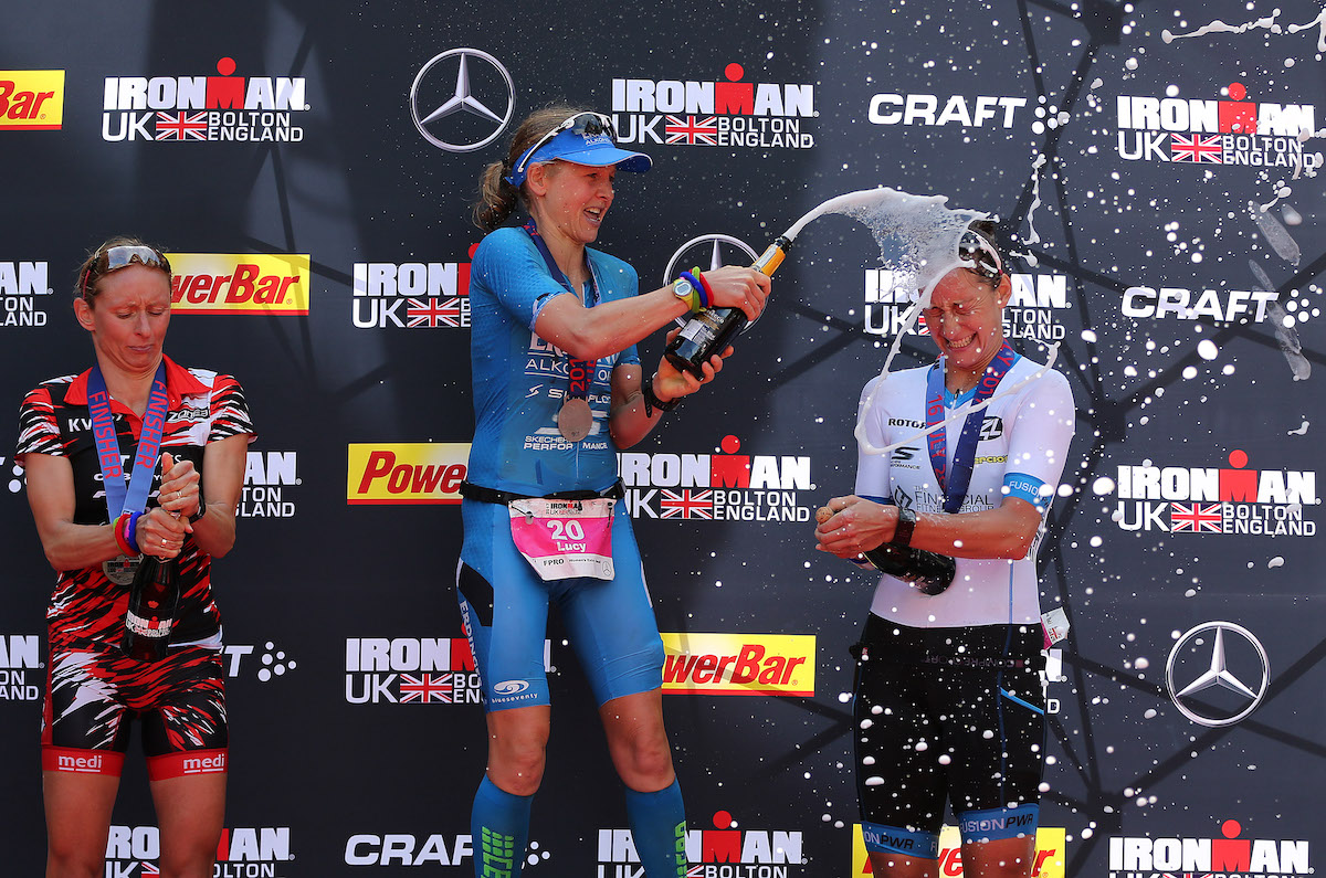 L-R: Germany's Diana Riesler (silver), GB's Lucy Gossage (gold) and Nikki Bartlett (bronze) celebrate on the podium of Ironman UK 2017
