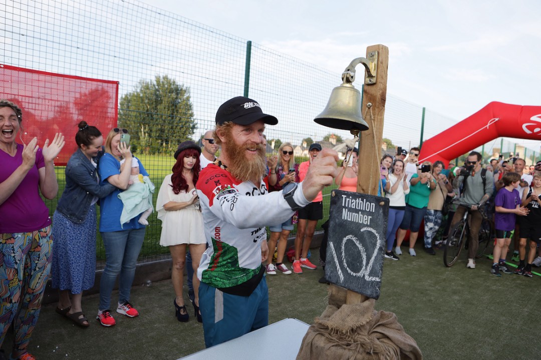 Sean Conway at the end of his 102nd iron-distance triathlon