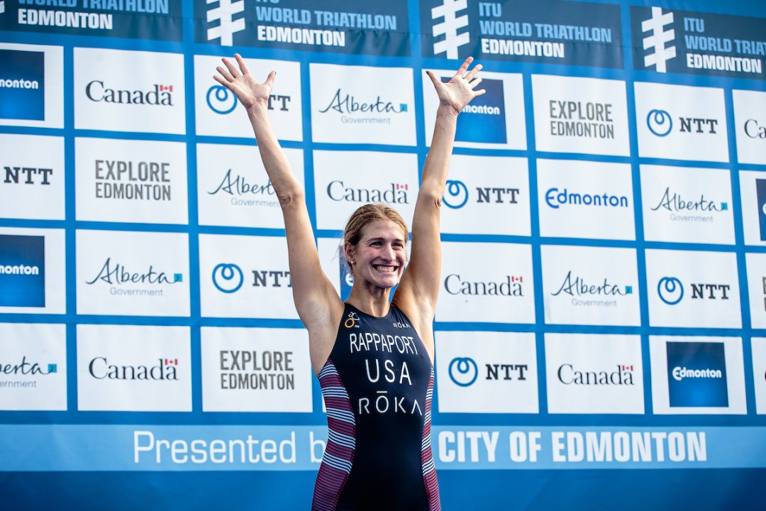 Summer Rappaport lifts her arms above her head as mounts the podium to collect silver at the 2019 Edmonton World Triathlon race