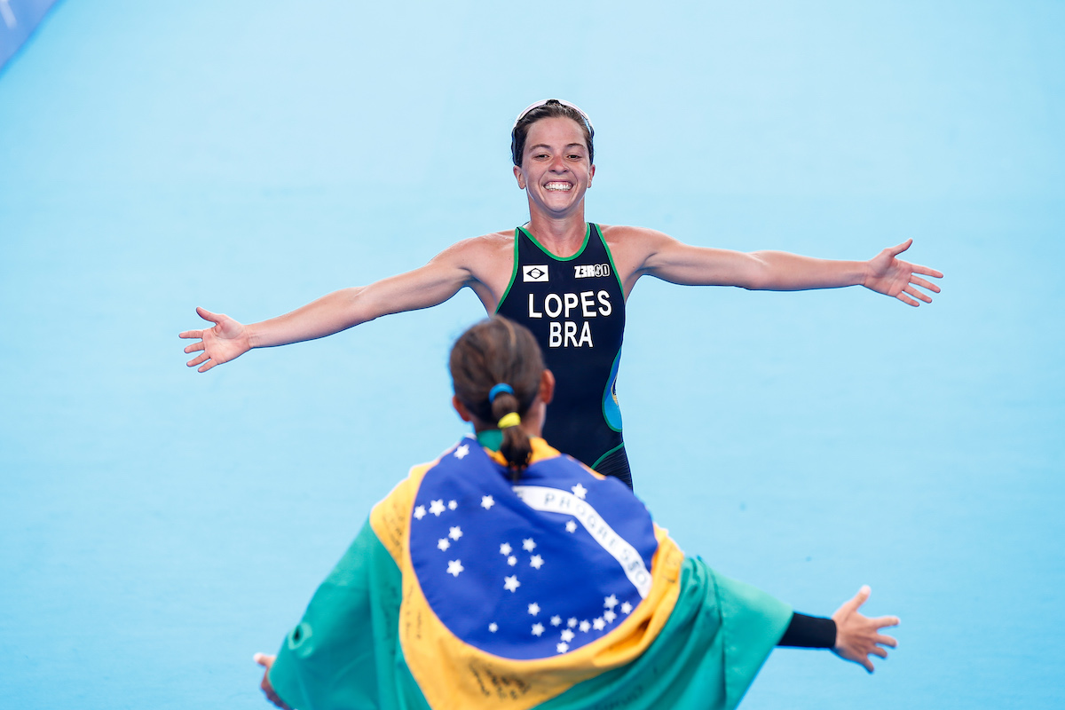 Silver medallist Vittoria Lopes is greeted by winner and compatriot Luisa Baptista at the finish line of the 2019 Pan American Games in Lima, Peru