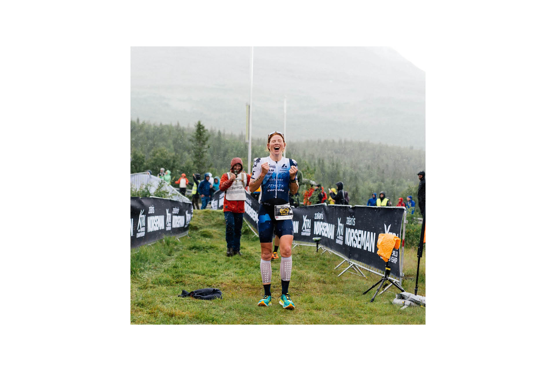 GB's Flora Colledge crosses the line to take the women's victory at Norseman 2023