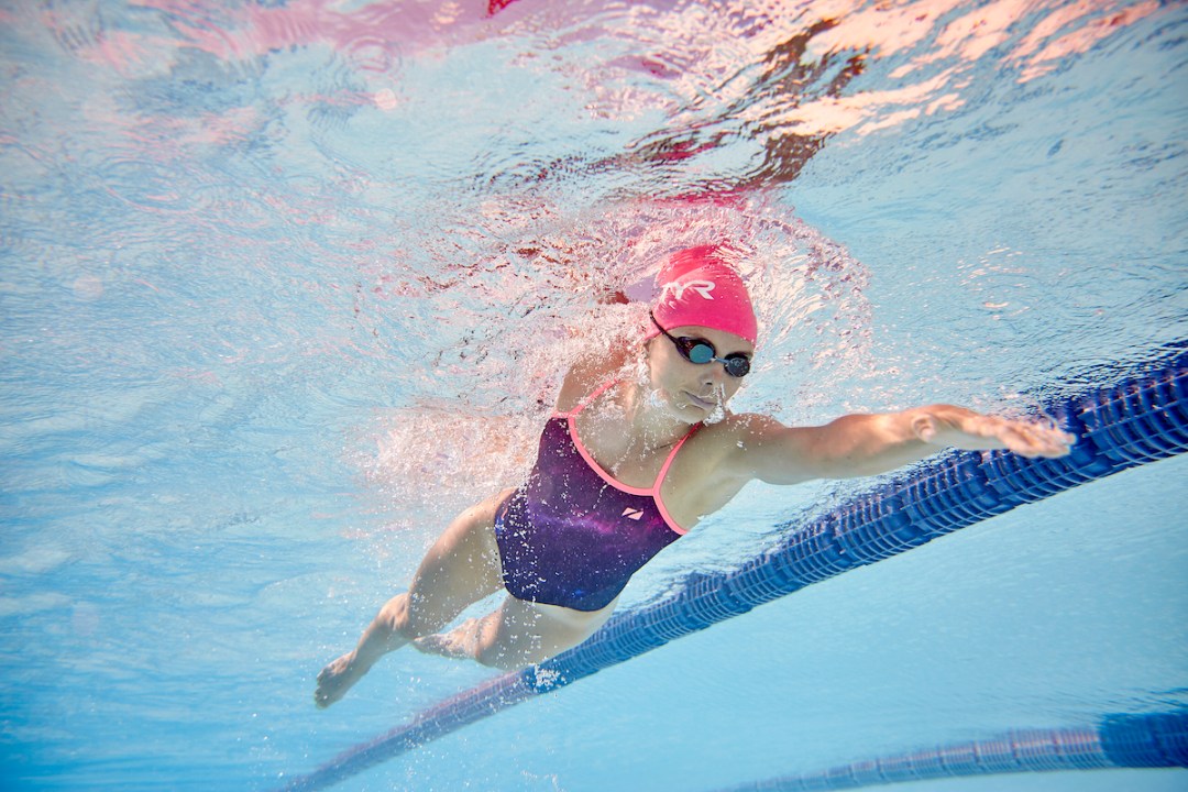 Underwater shot of female swimmer doing front crawl in pool