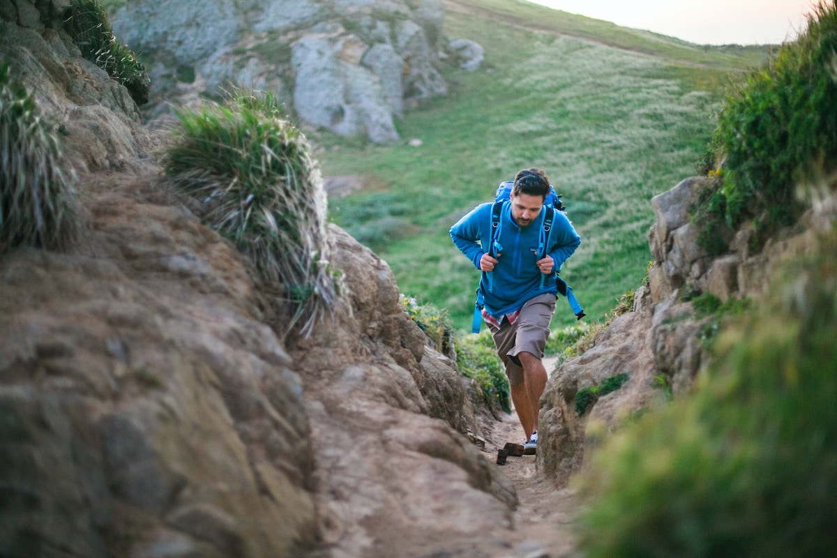 Man walking between rocks